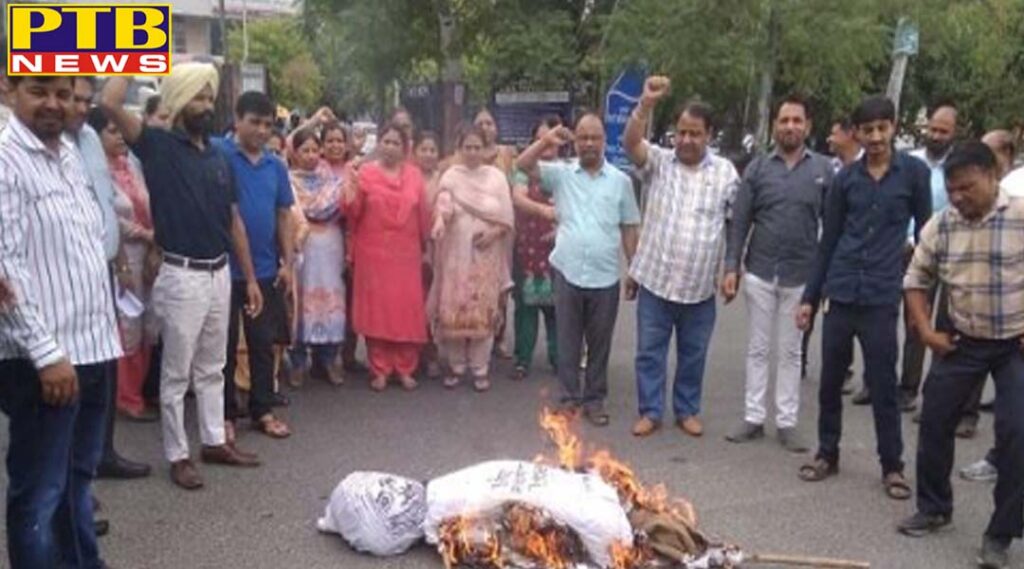 Jalandhar DC office workers blow the effigy of punjab government