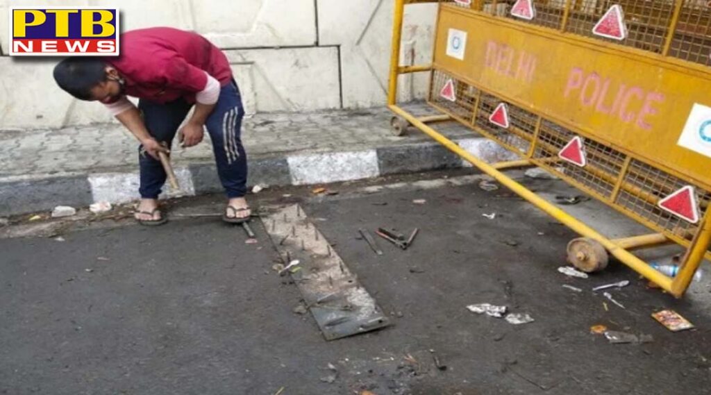 delhi nail that were fixed near barricades at ghazipur border are being removed ptb news big breaking