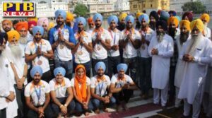 crowds of people gathered at the airport to welcome hockey players in amritsar Punjab
