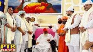 Punjab Food and Civil Supplies Minister Lal Chand Kataruchak presenting flowers of reverence to Sant Ramanand ji on the occasion of Sant Ramanand ji's death anniversary at Dera Sant Shravan Das Balan